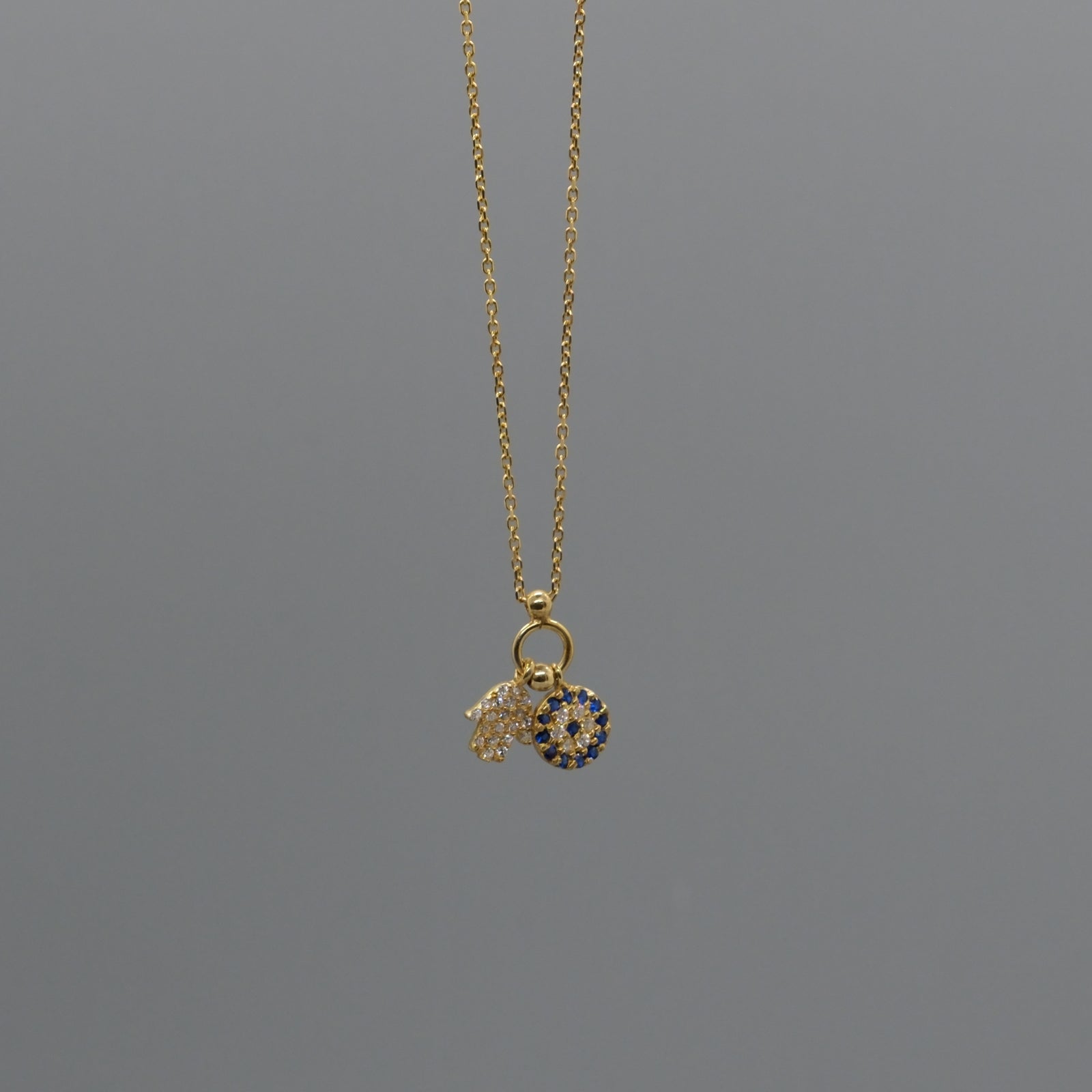 Hamsa and eye necklace