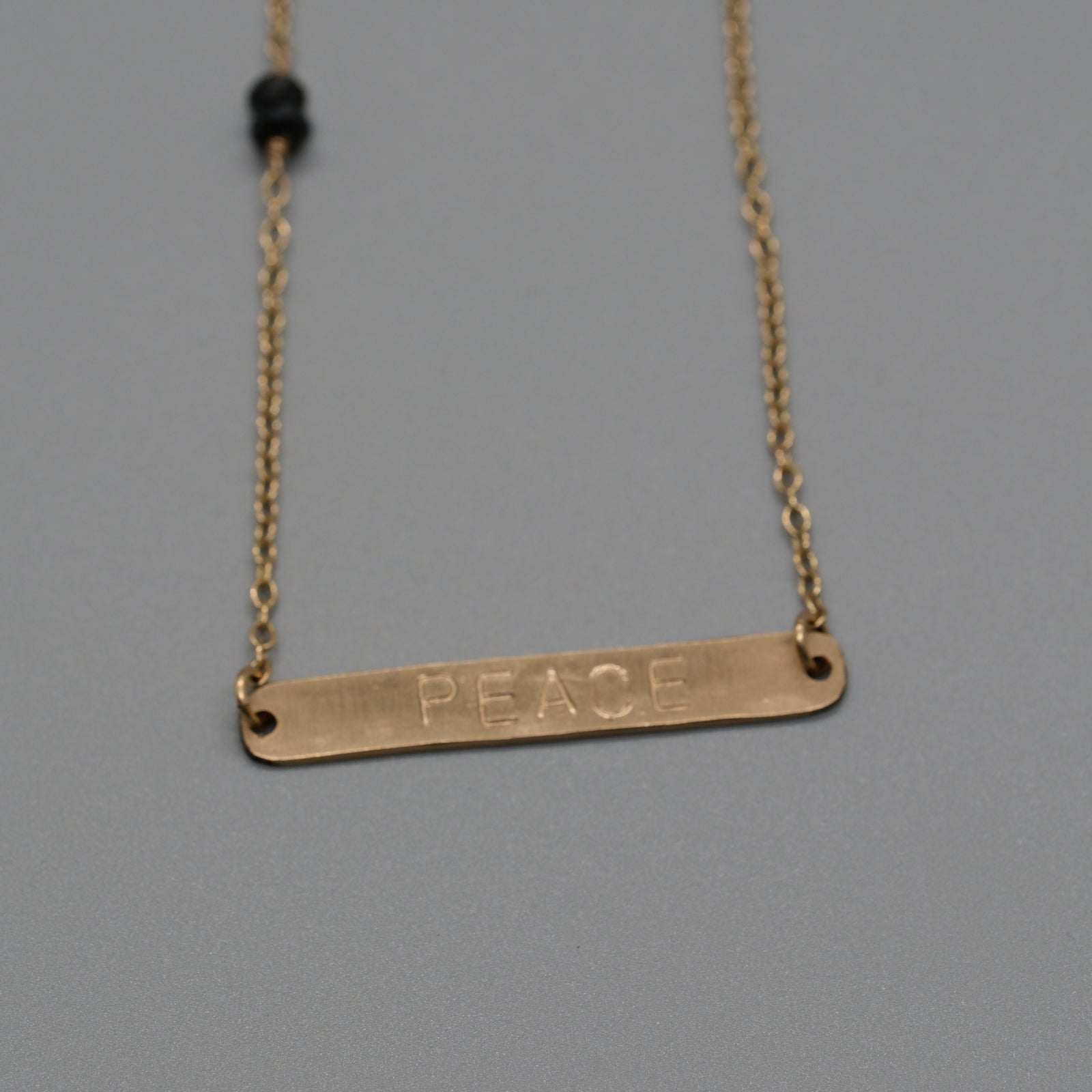 Peace with black onyx necklace