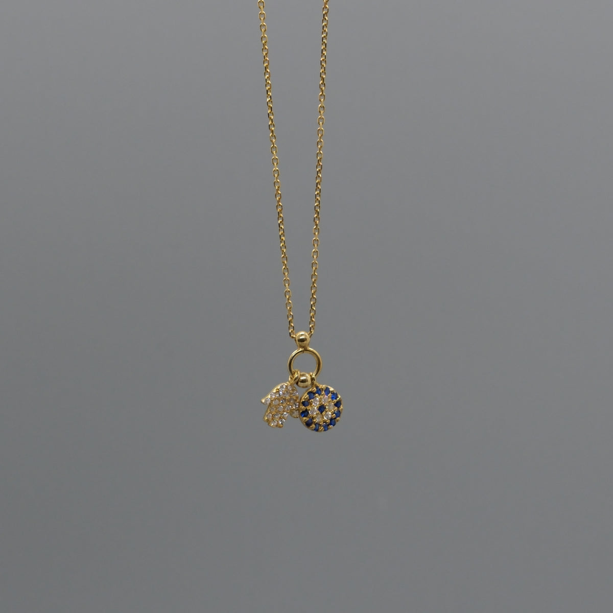 Hamsa and eye necklace