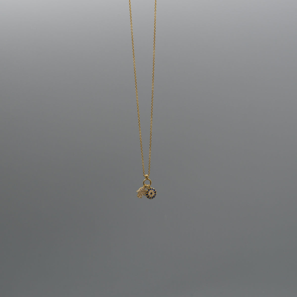 Hamsa and eye necklace