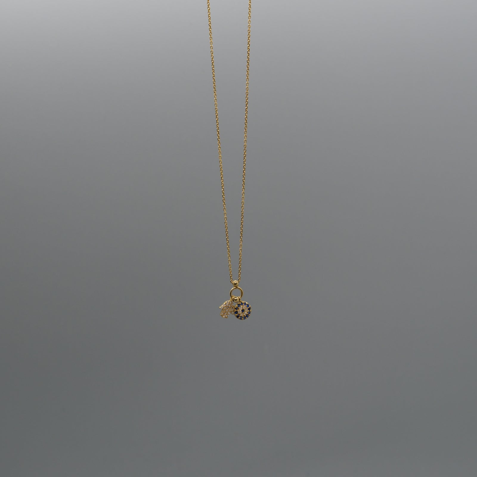 Hamsa and eye necklace