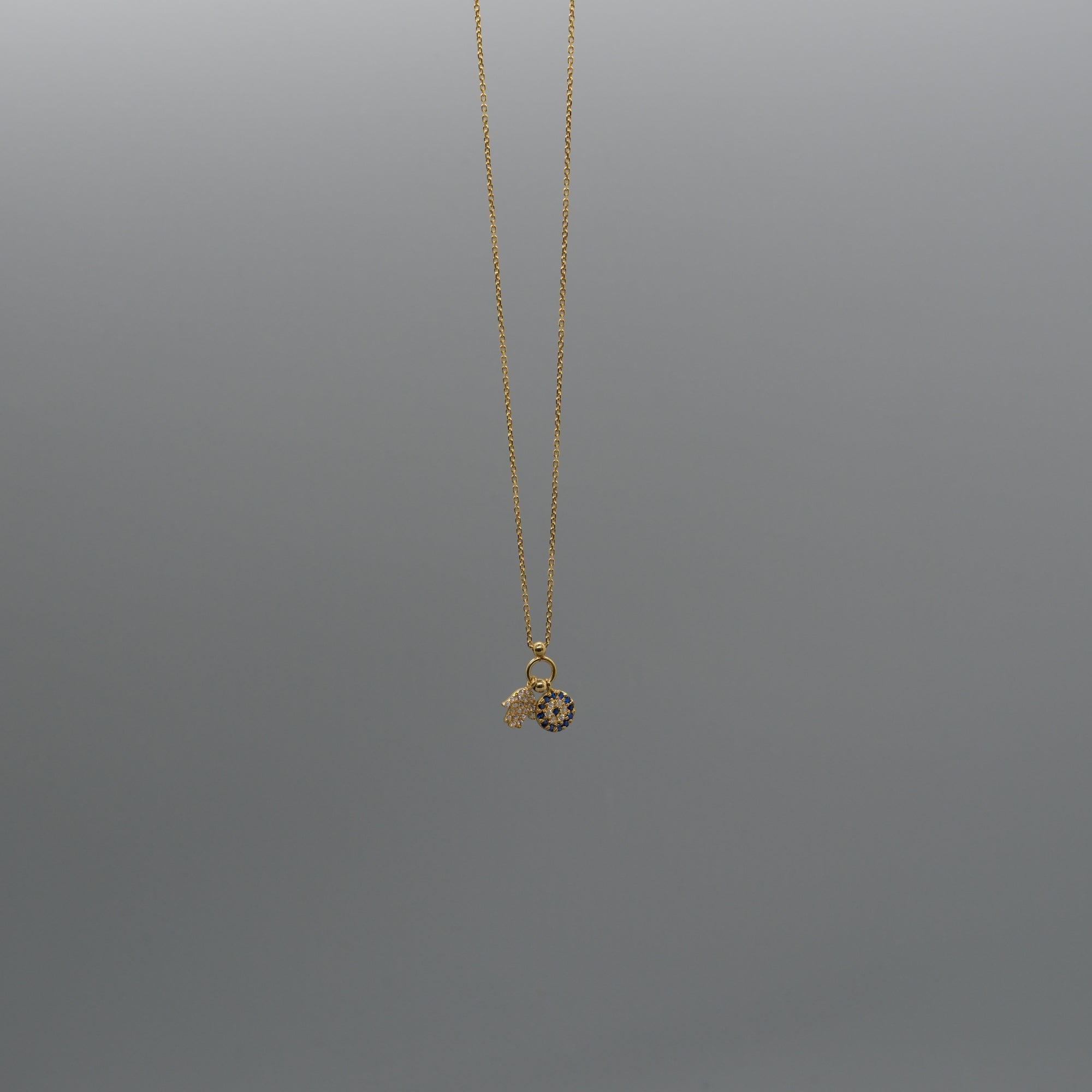 Hamsa and eye necklace