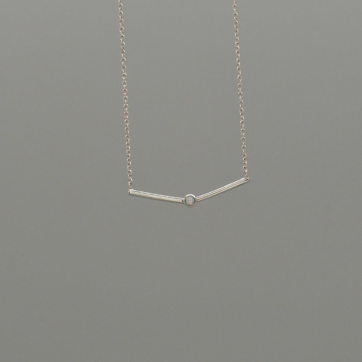 curved bar with Opal necklace