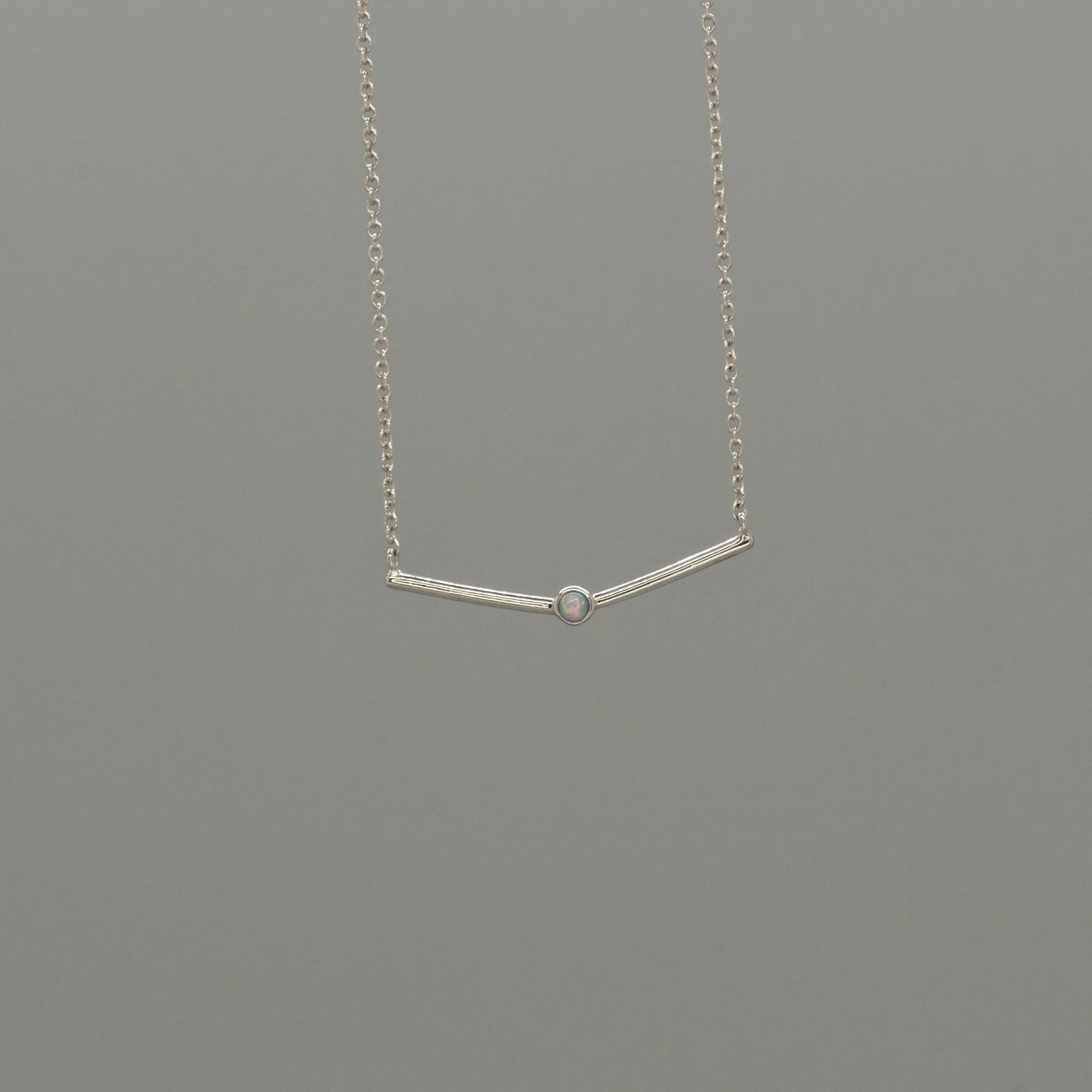 curved bar with Opal necklace