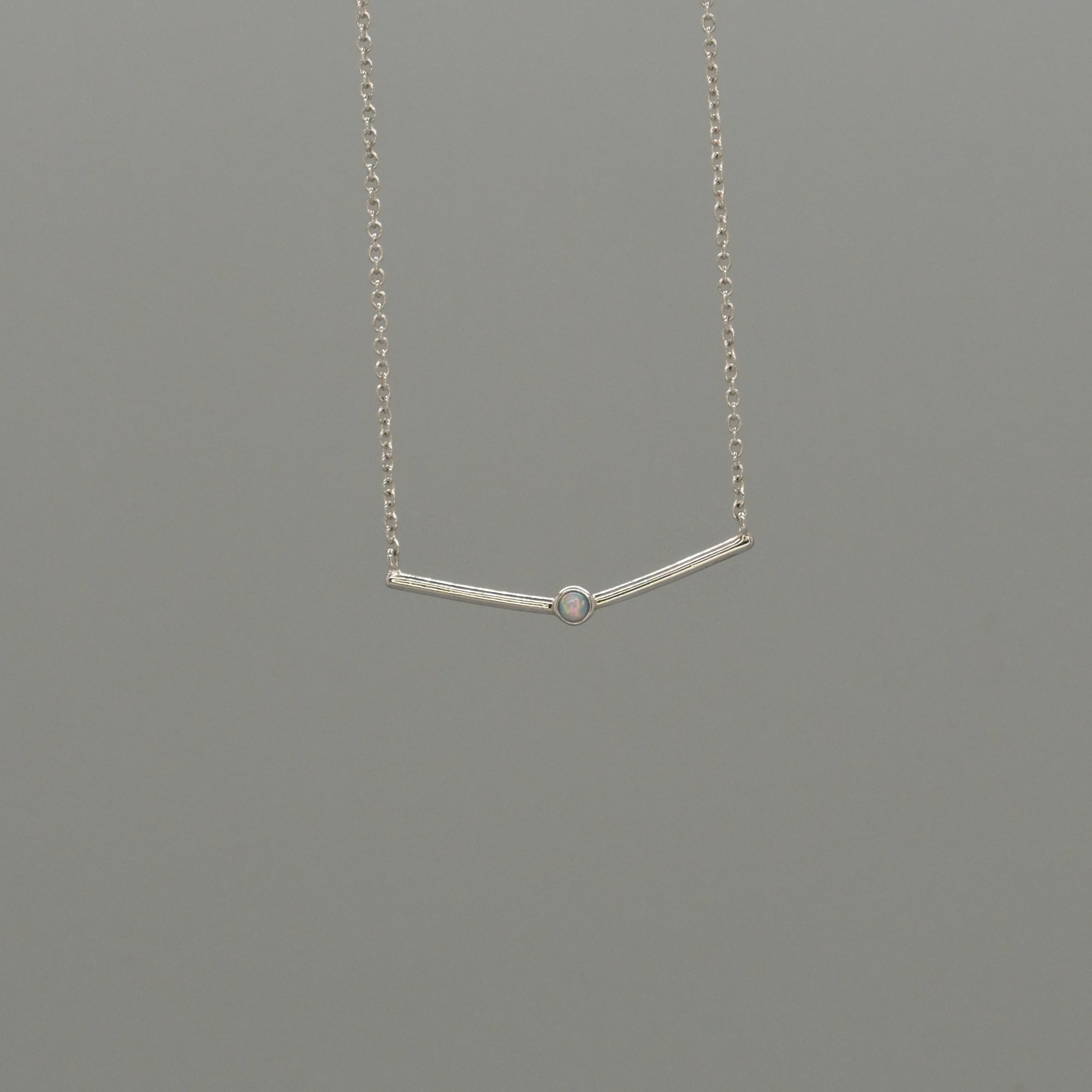 curved bar with Opal necklace