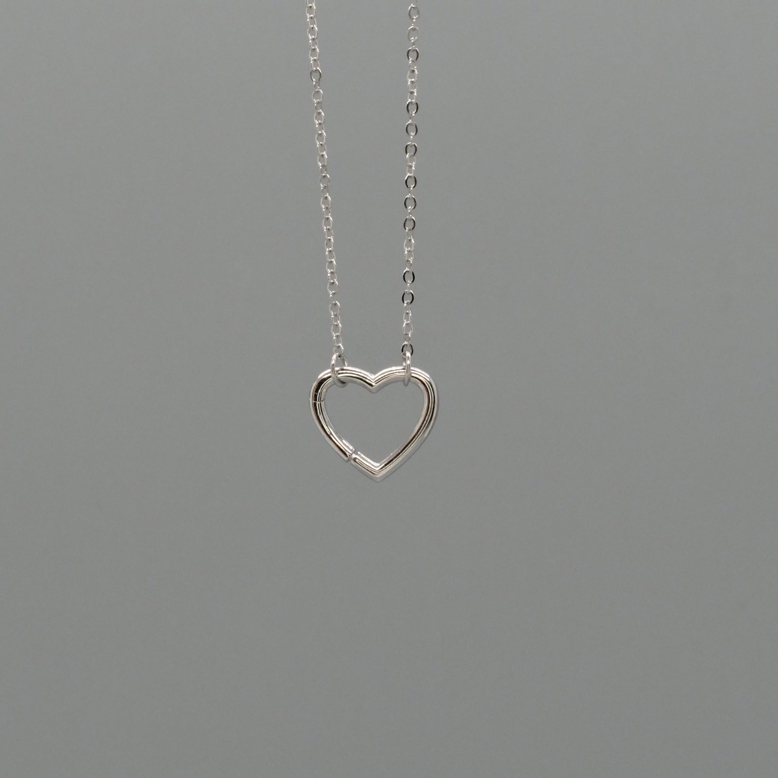 Open heart charm necklace