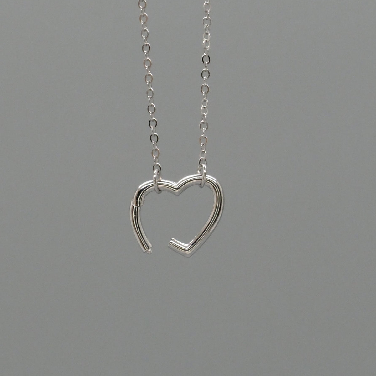 Open heart charm necklace