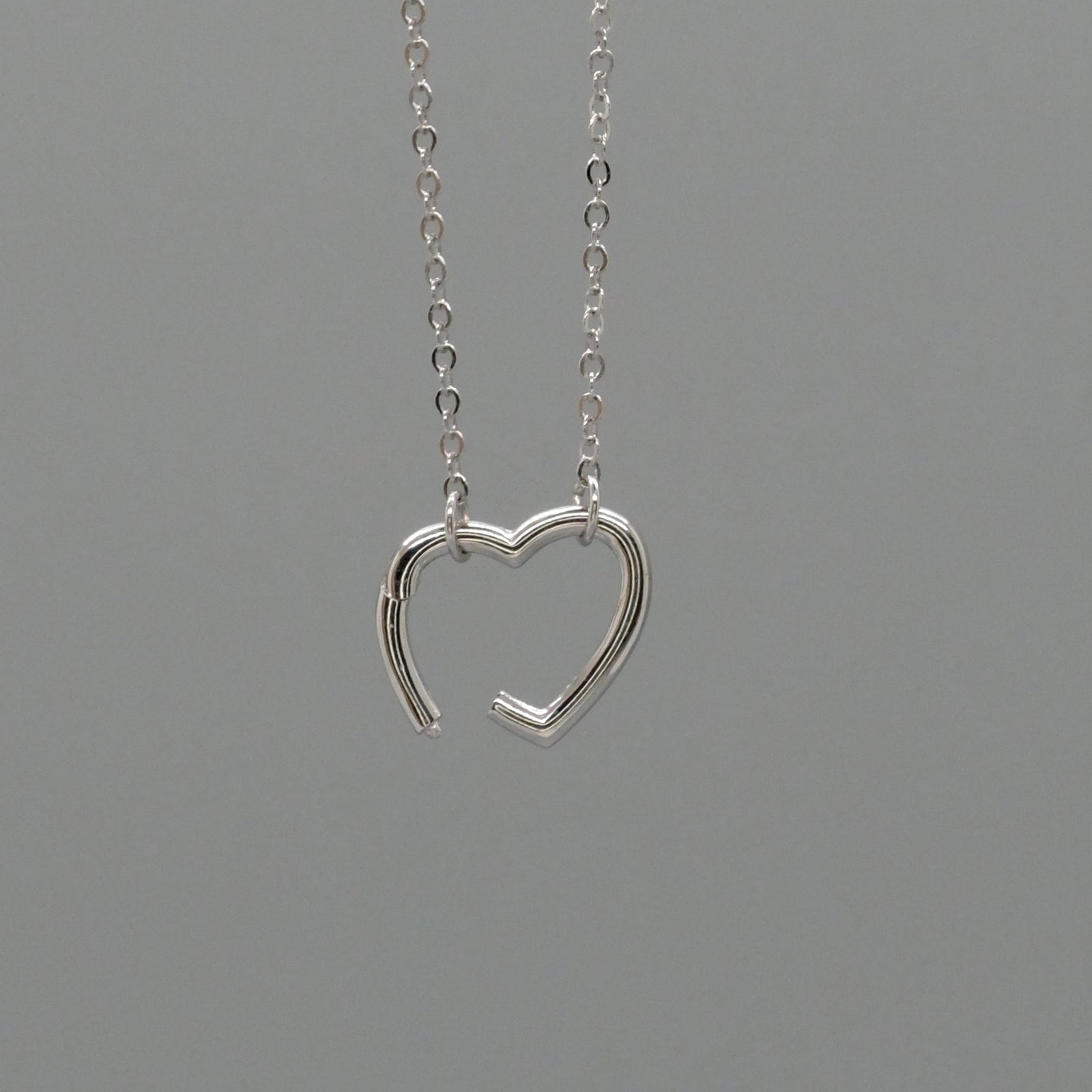 Open heart charm necklace