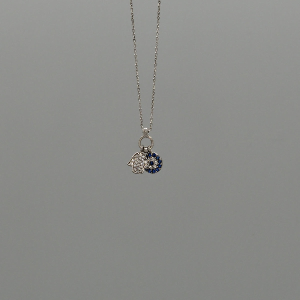 Hamsa and eye necklace
