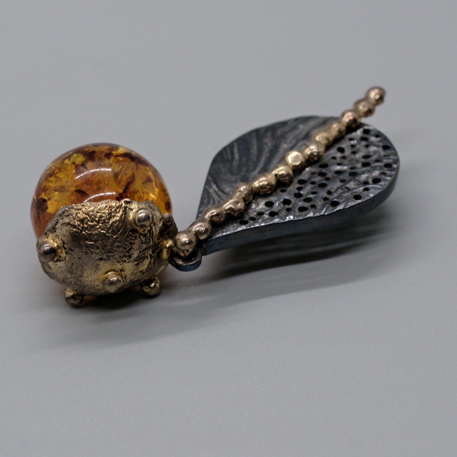 Artisan Amber Orb & Leaf Long Pendant