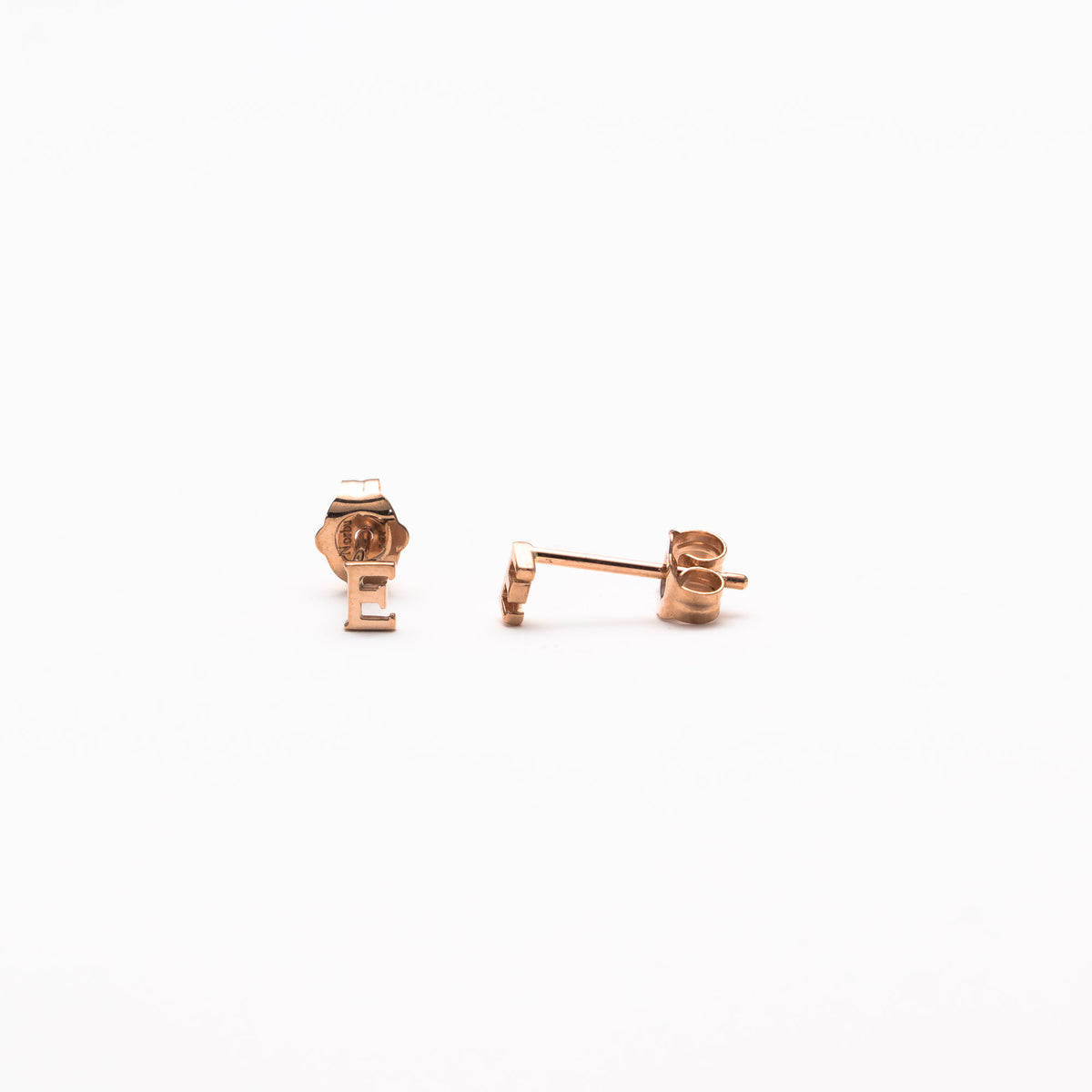 Single initial studs in rose gold