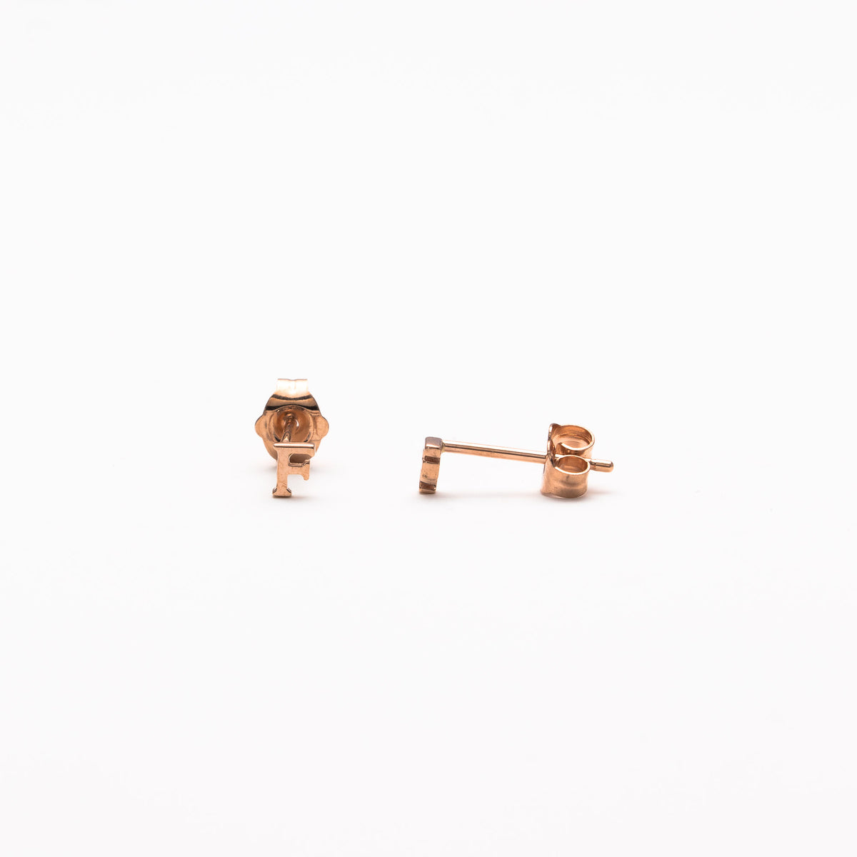 Single initial studs in rose gold