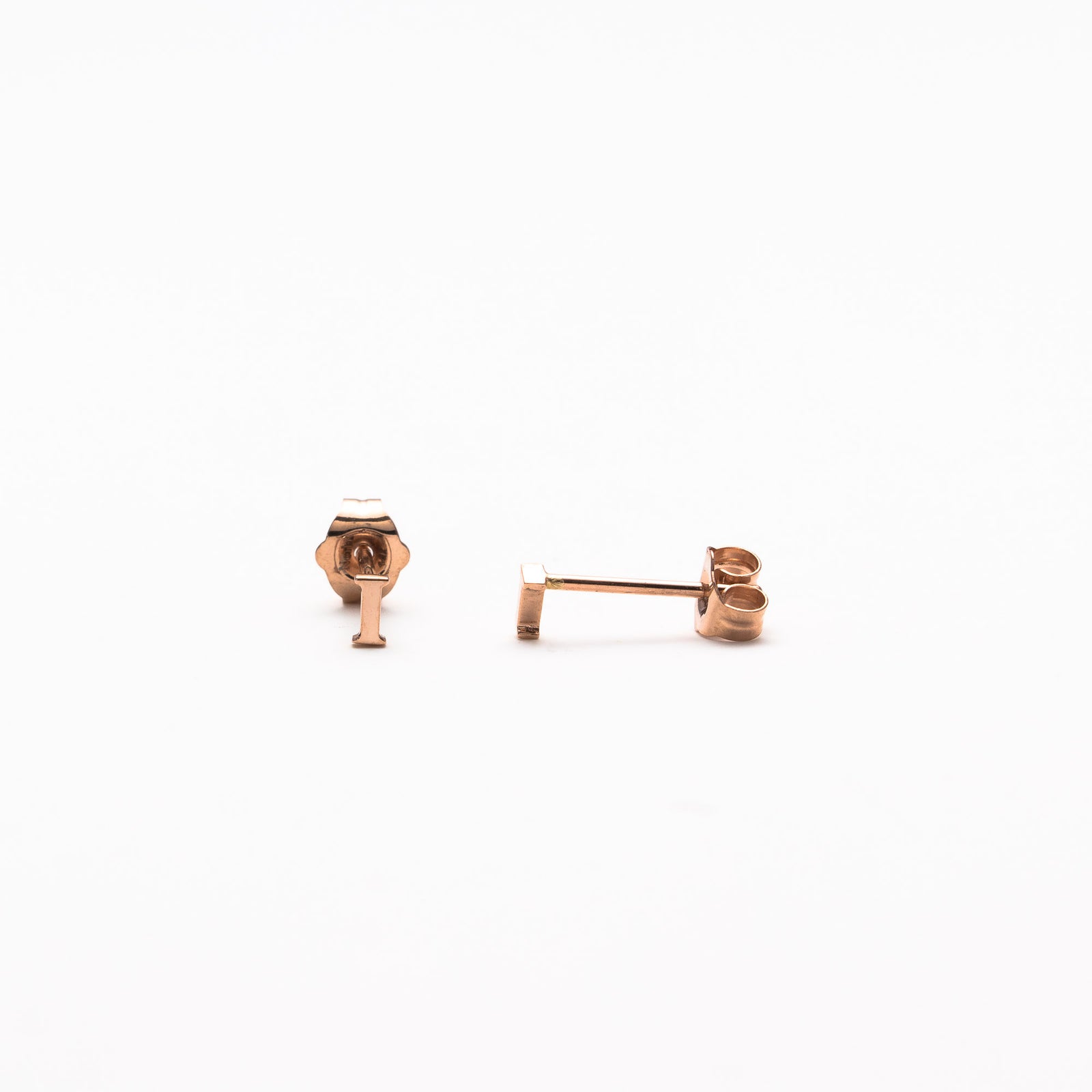 Single initial studs in rose gold