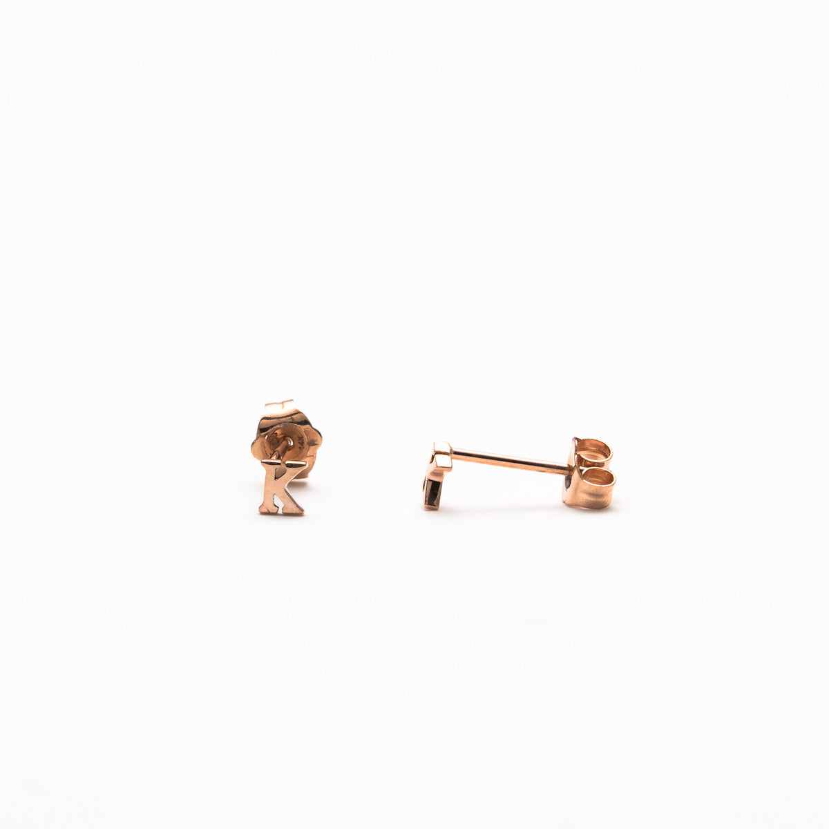 Single initial studs in rose gold
