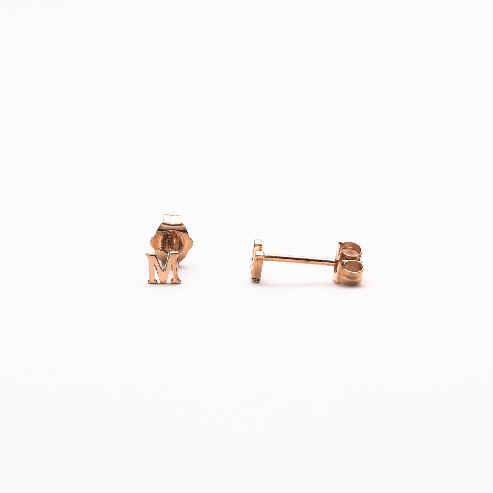 Single initial studs in rose gold