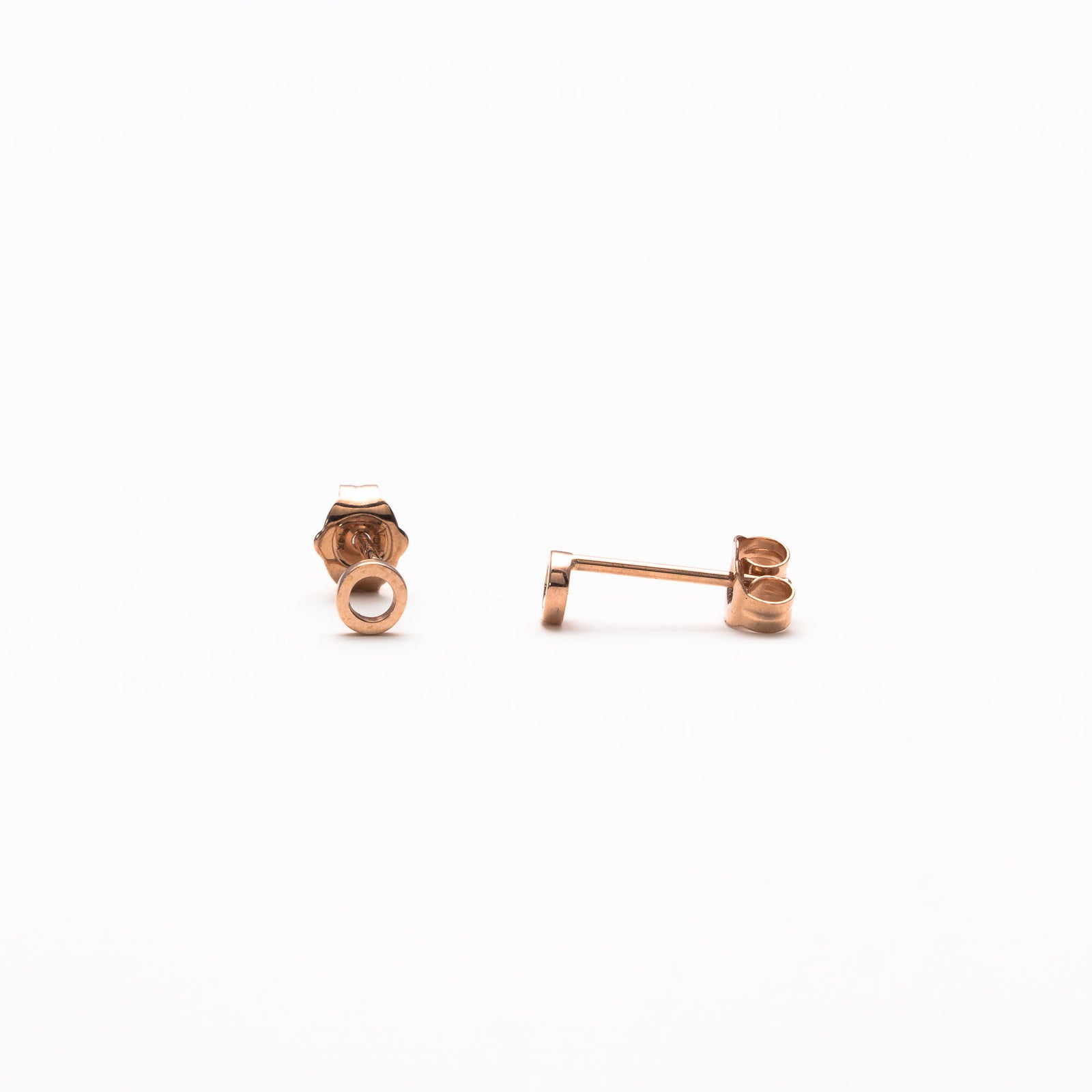Single initial studs in rose gold