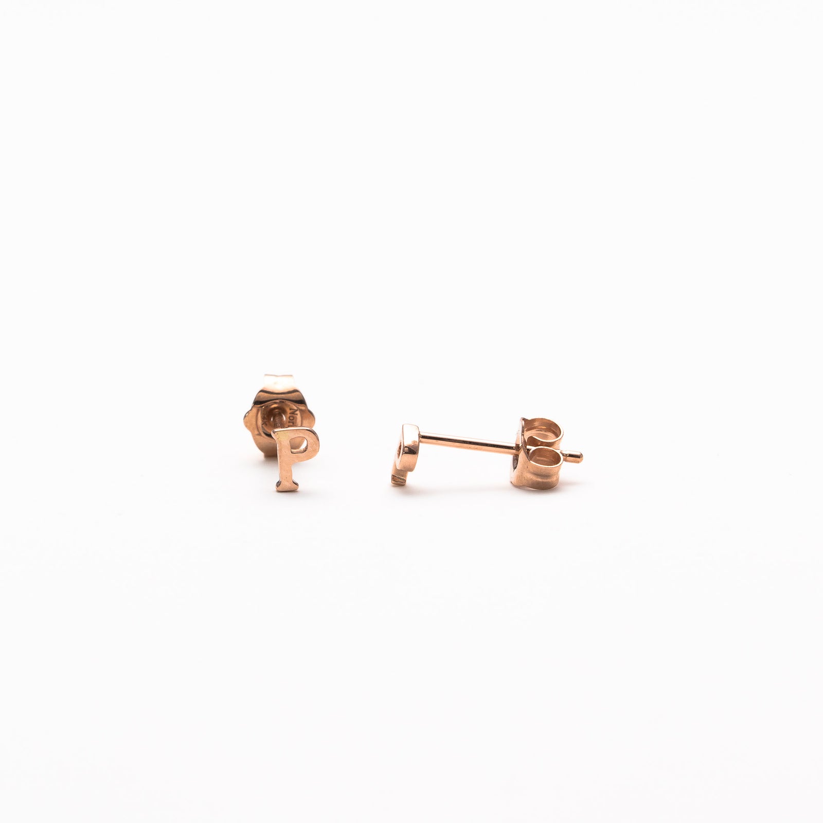 Single initial studs in rose gold