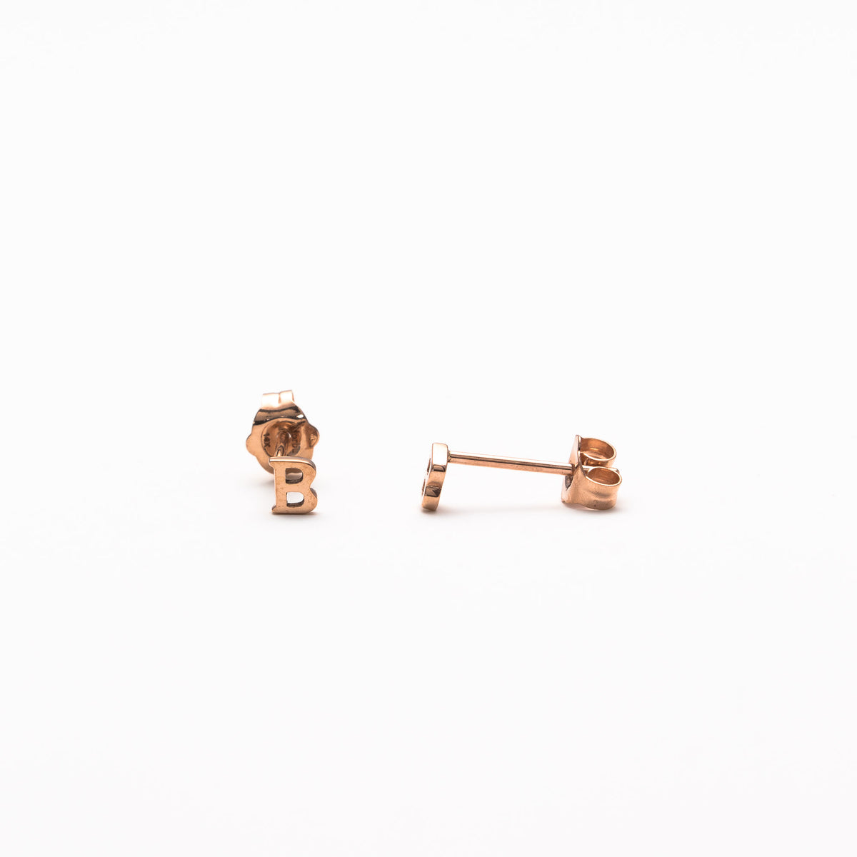 Single initial studs in rose gold
