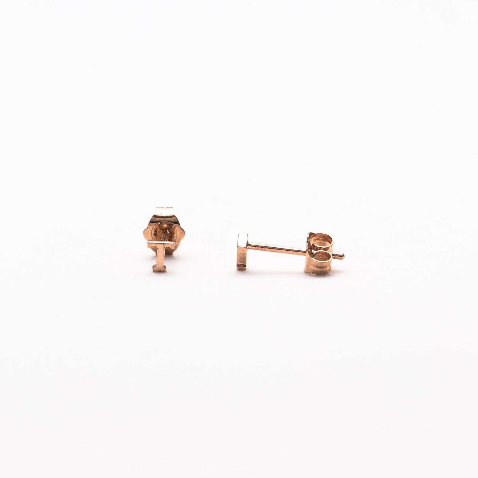 Single initial studs in rose gold