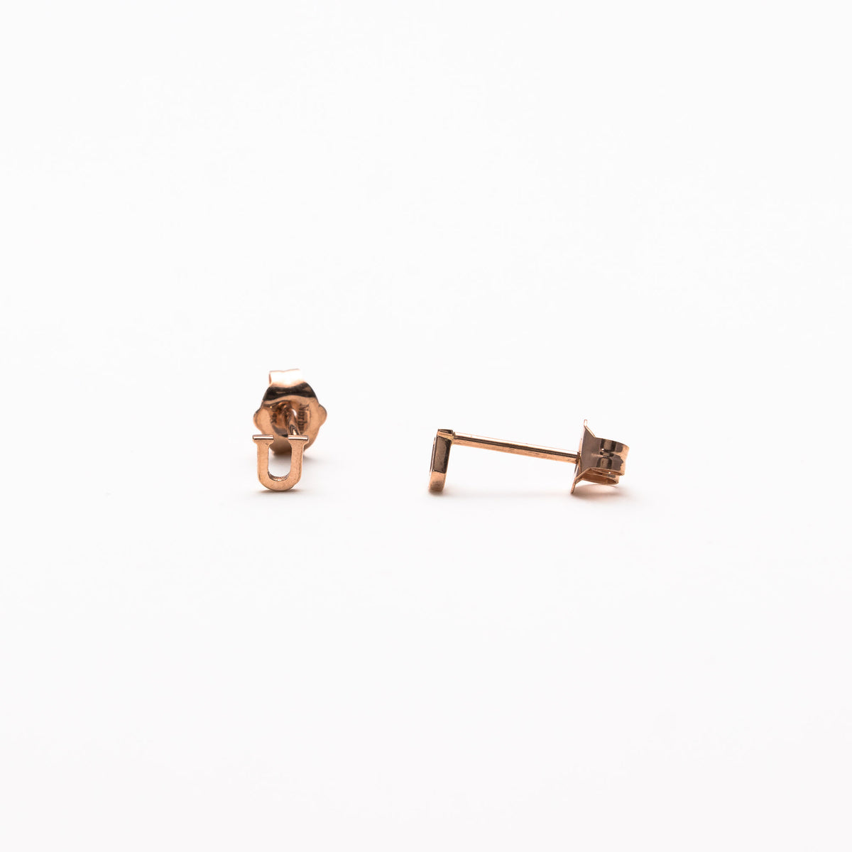 Single initial studs in rose gold