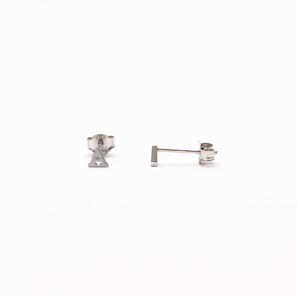 Single initial studs in silver