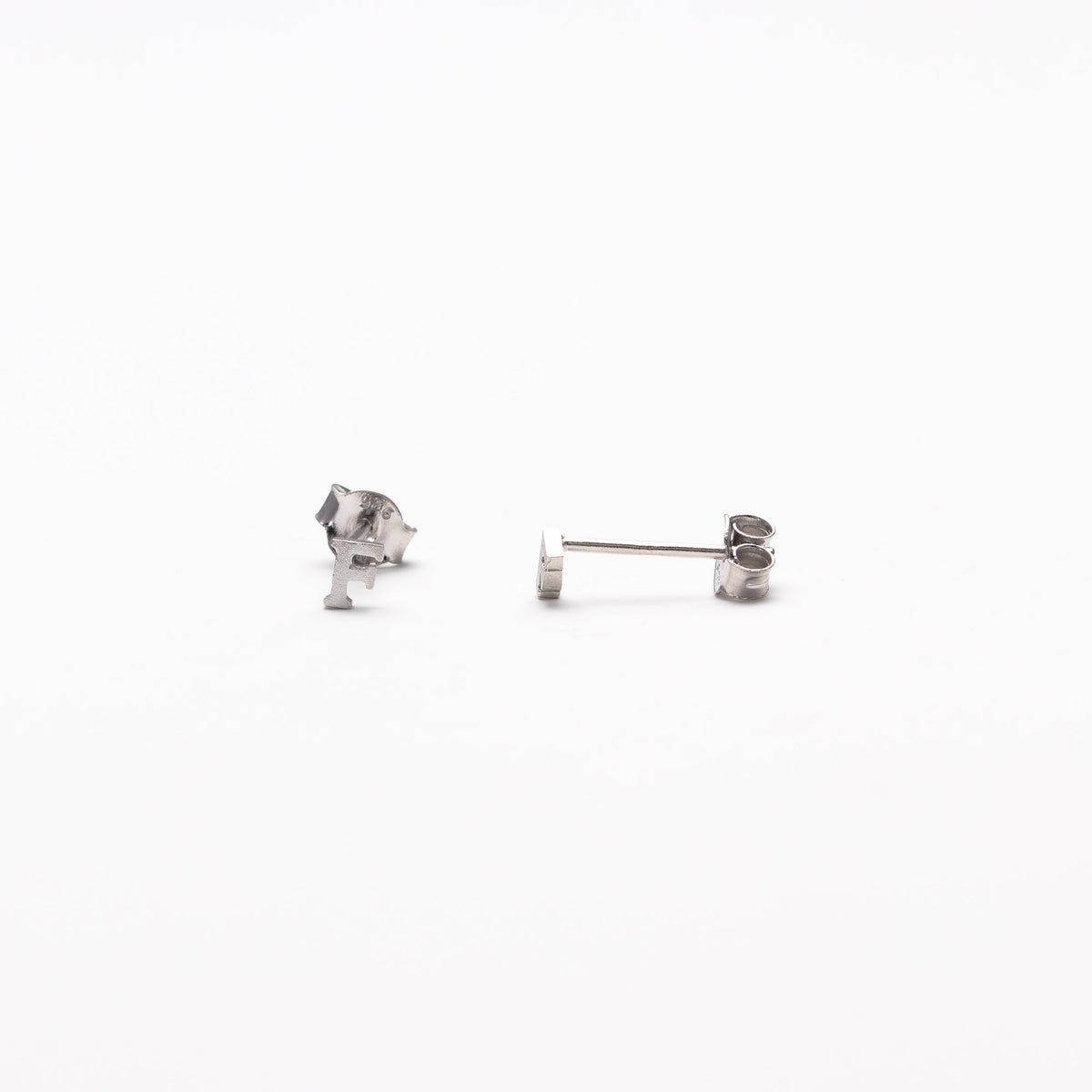 Single initial studs in silver
