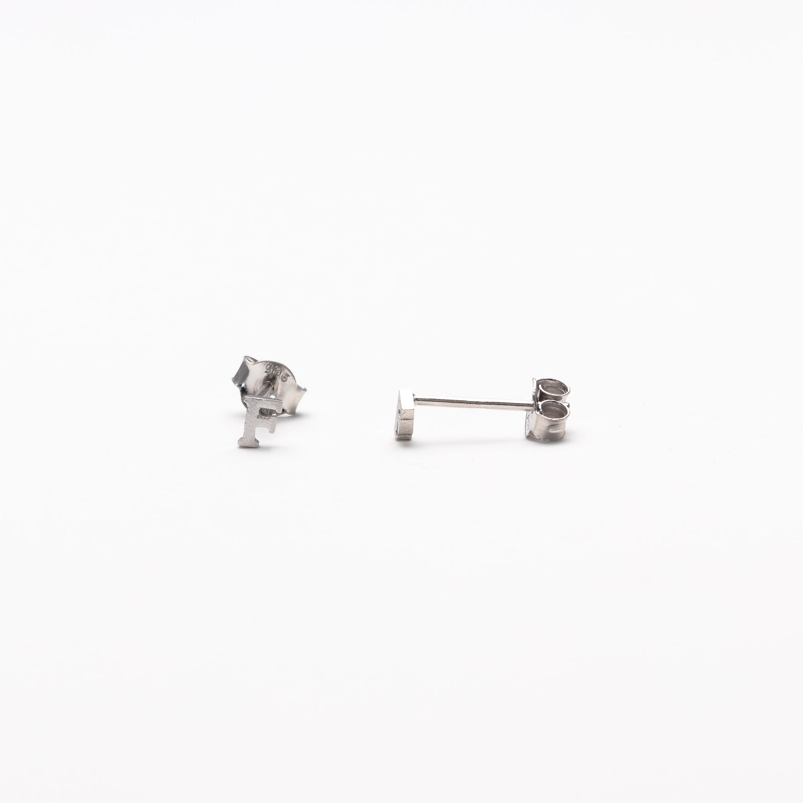 Single initial studs in silver