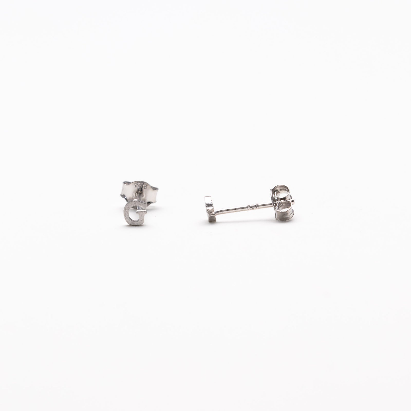Single initial studs in silver