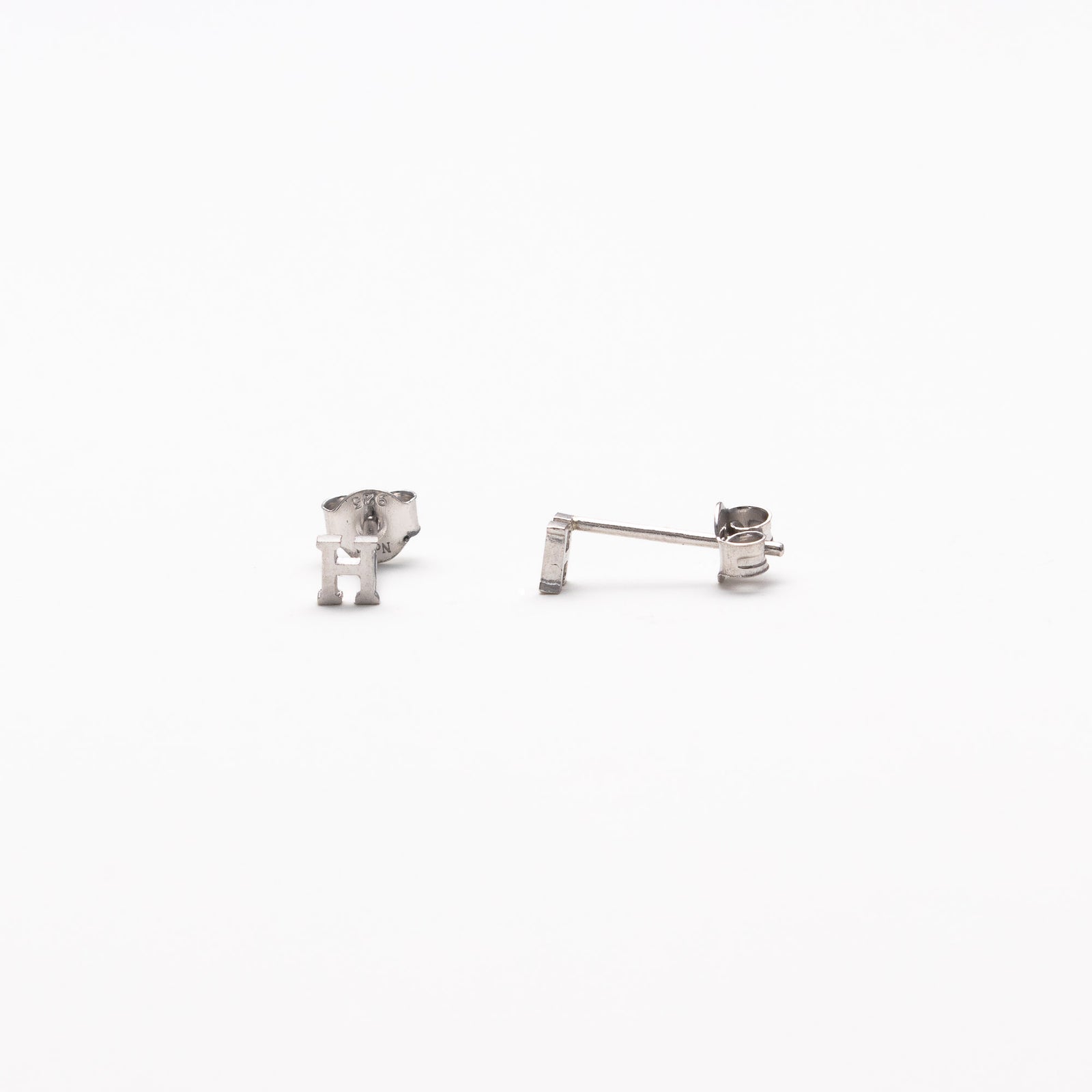 Single initial studs in silver